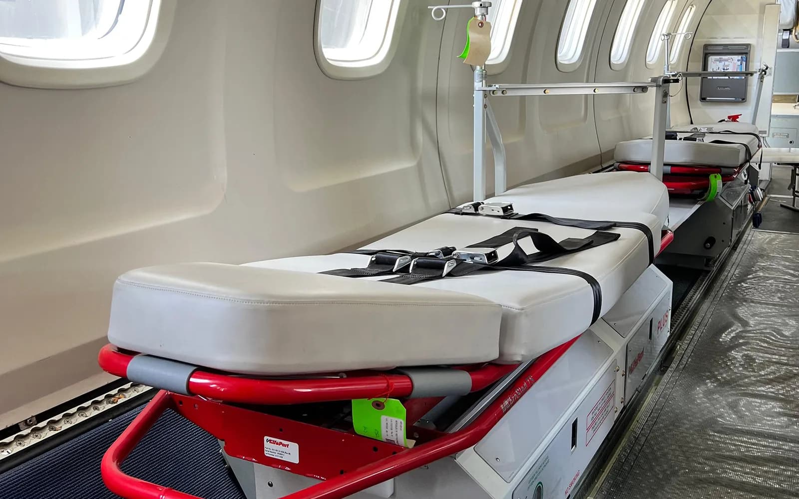 A stretcher and medical equipment fitted in the cabin of an ALS air ambulance.