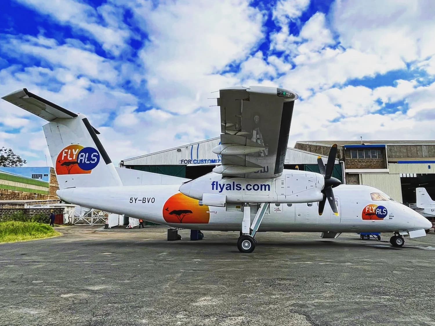 ALS Dash 8-100 5Y-BVO in Fly ALS colours outside the hangar at Wilson