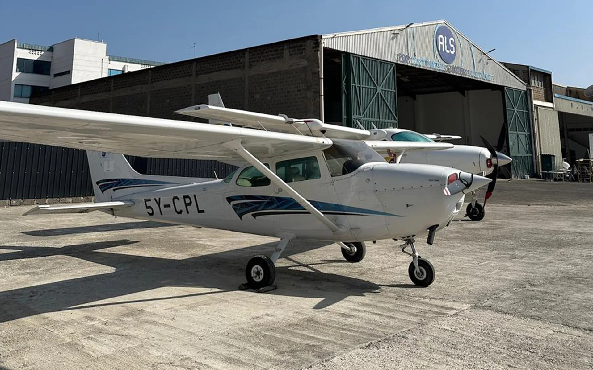 An ALS Flight Training Cessna 172, 5Y-CPL, outside the ALS hangar at Wilson Airport