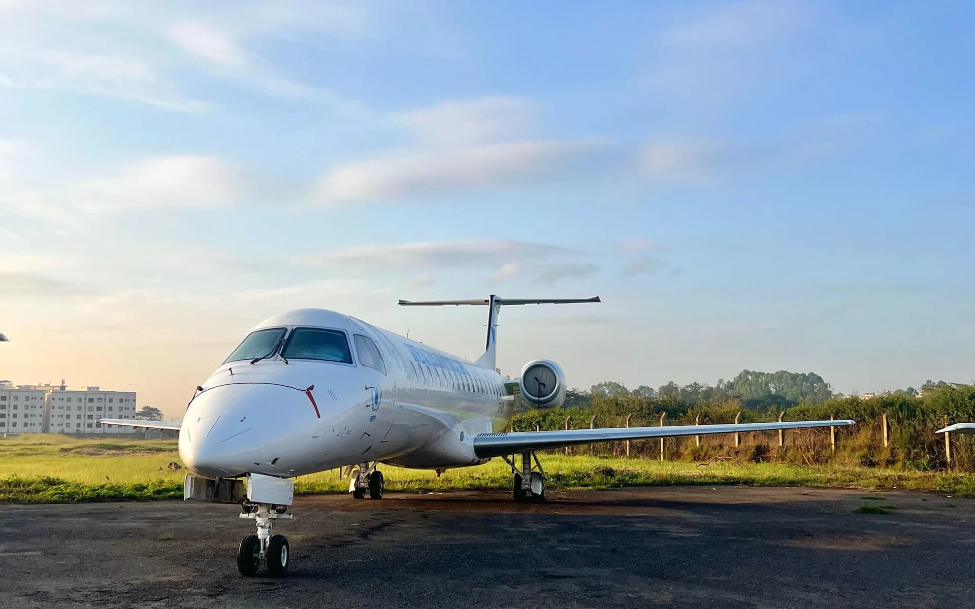 An ALS Embraer ERJ-145 on the apron in the early light